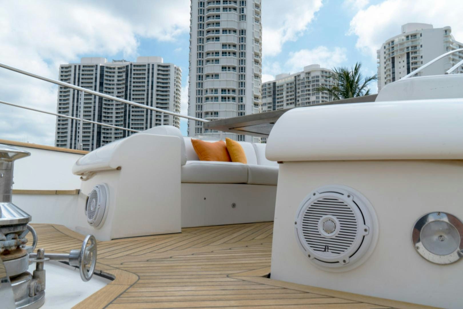 a deck with a large white sheet over it and a large white building in the background aboard ADAR Yacht for Sale