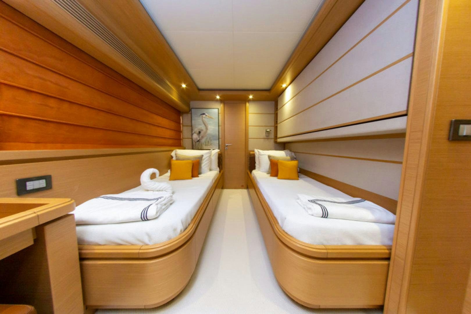 a room with a bed and a desk aboard ADAR Yacht for Sale