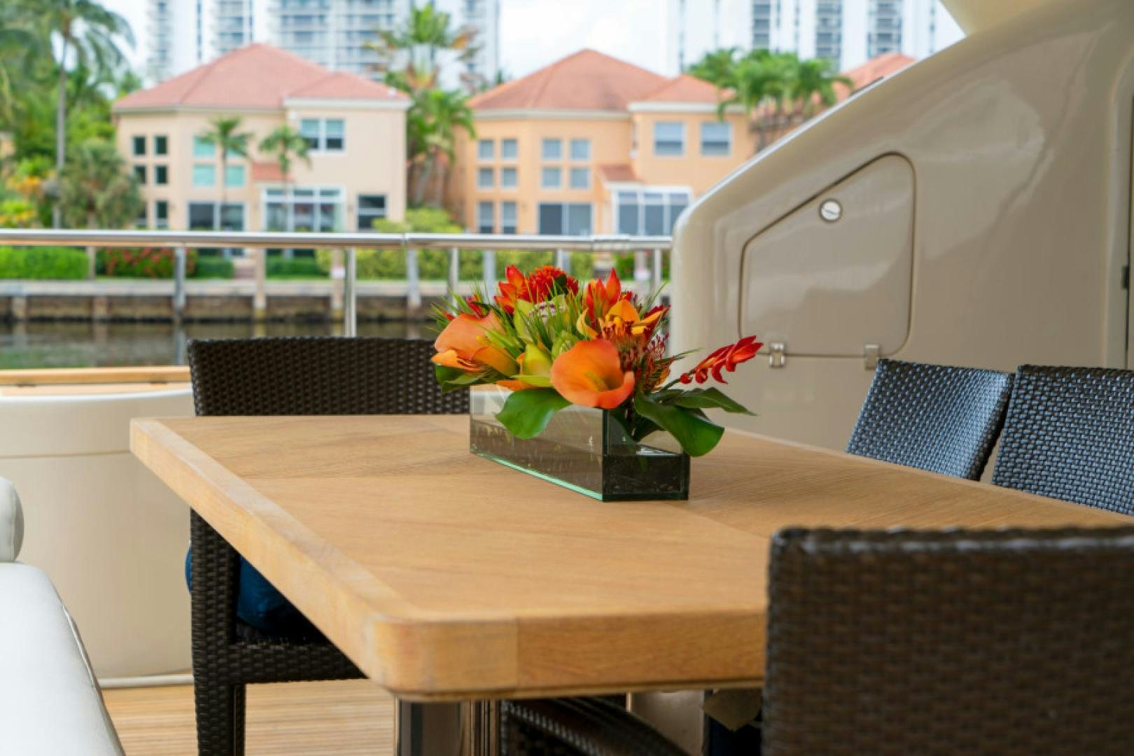 a vase of flowers on a table aboard ADAR Yacht for Sale