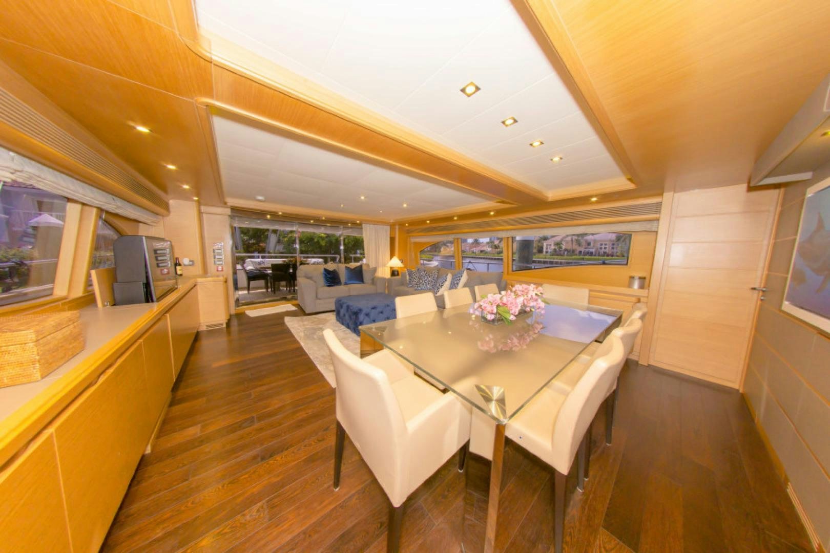 a large kitchen with a dining table aboard ADAR Yacht for Sale