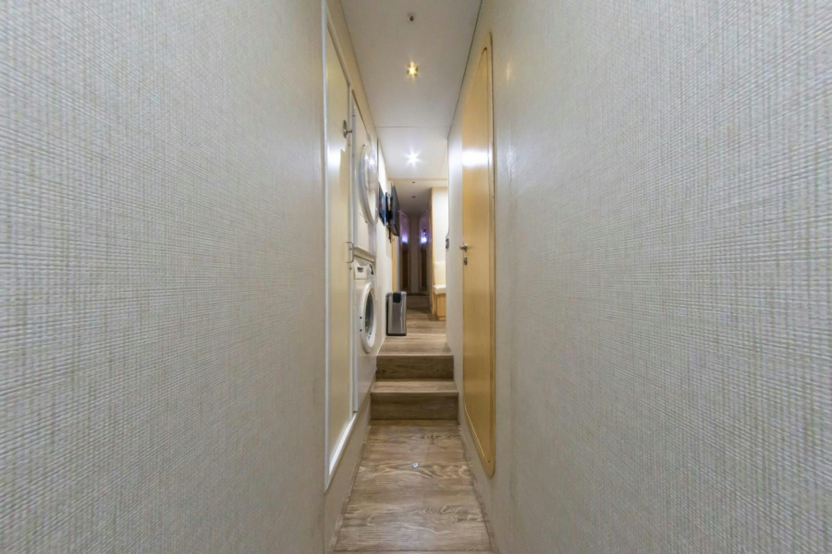 a hallway with white walls aboard ADAR Yacht for Sale