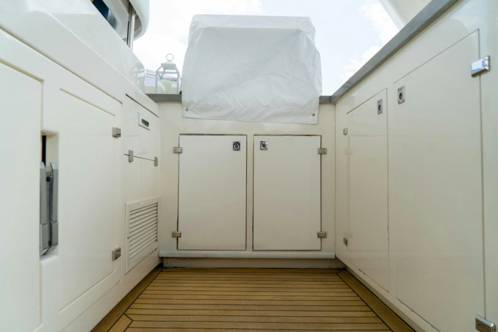 a room with white cabinets aboard ADAR Yacht for Sale