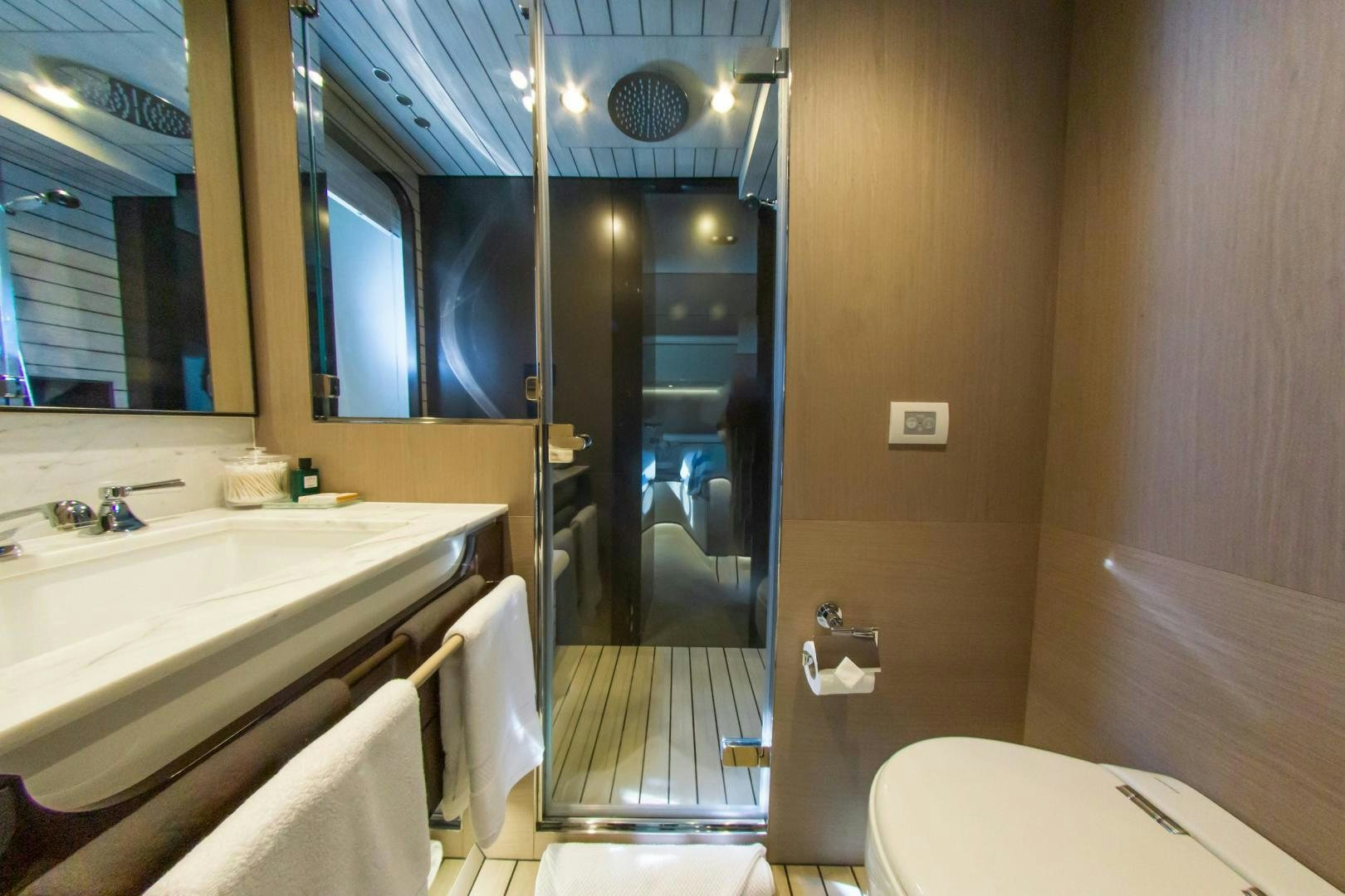 a bathroom with a glass shower aboard RINA Yacht for Sale