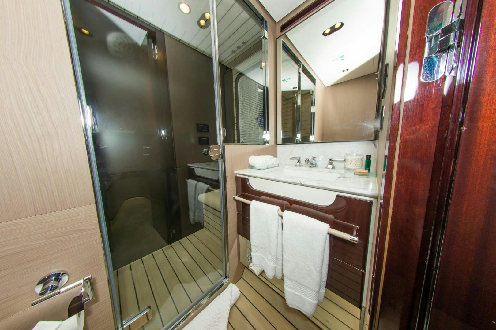 a bathroom with a large mirror aboard RINA Yacht for Sale