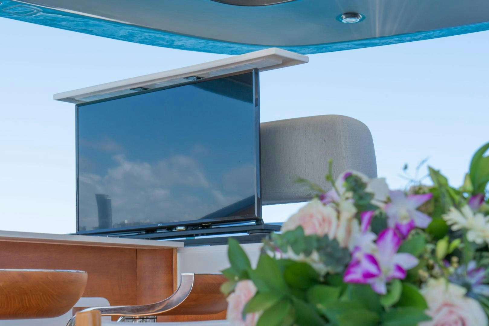 a tv on a table aboard RINA Yacht for Sale