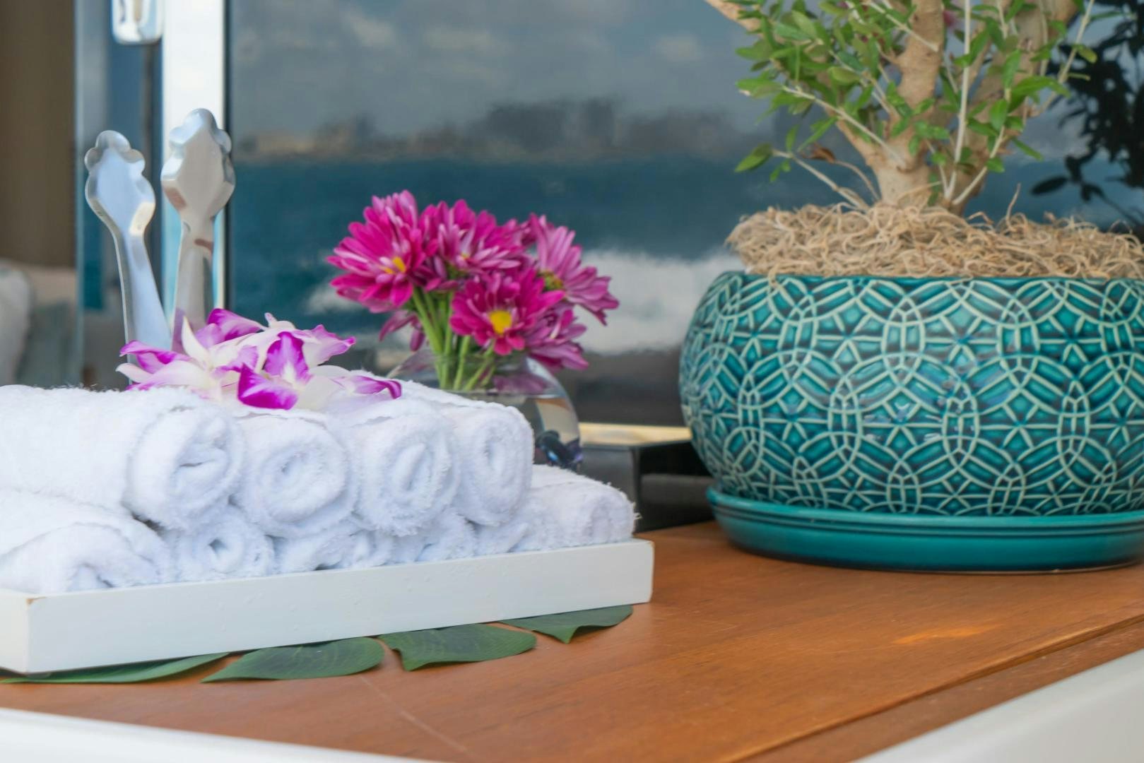 a white cake with a flower on it aboard RINA Yacht for Sale