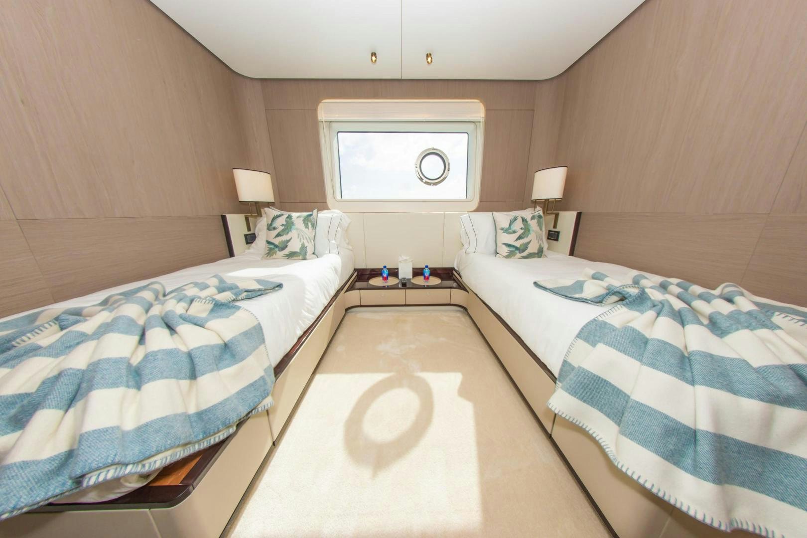a room with a bed and a mirror aboard RINA Yacht for Sale