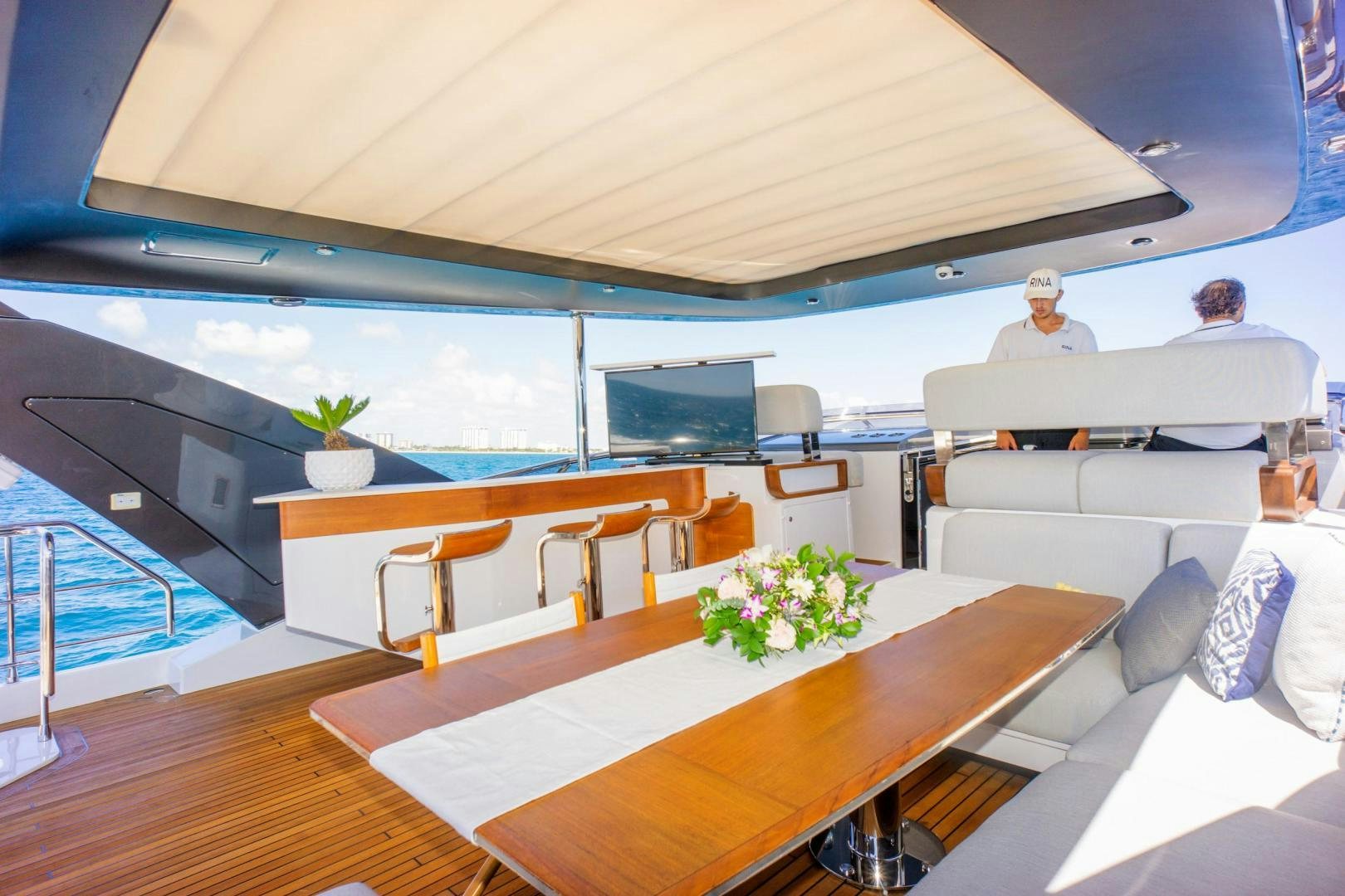 a room with a table and chairs aboard RINA Yacht for Sale