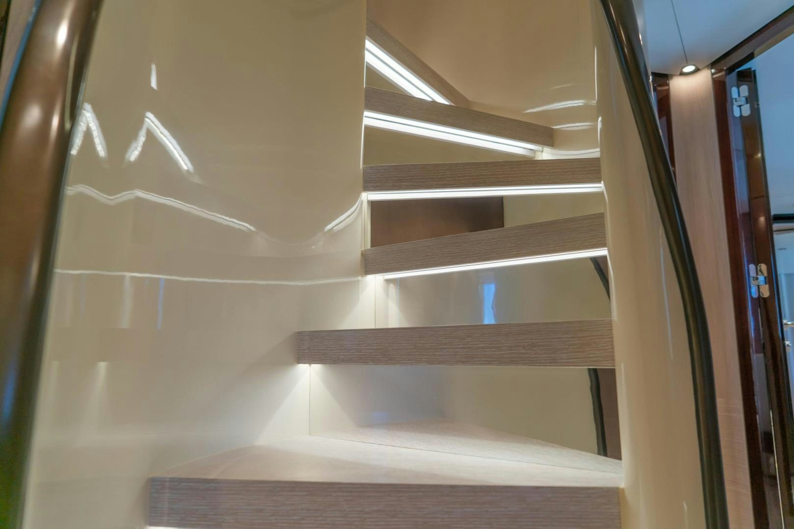 a white wall with a metal railing aboard RINA Yacht for Sale