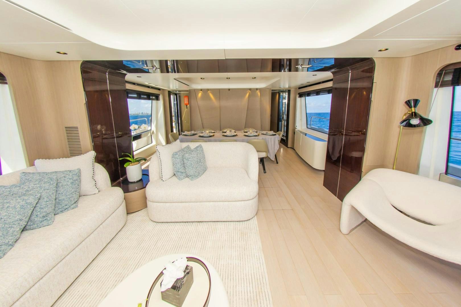 a living room with a large window aboard RINA Yacht for Sale