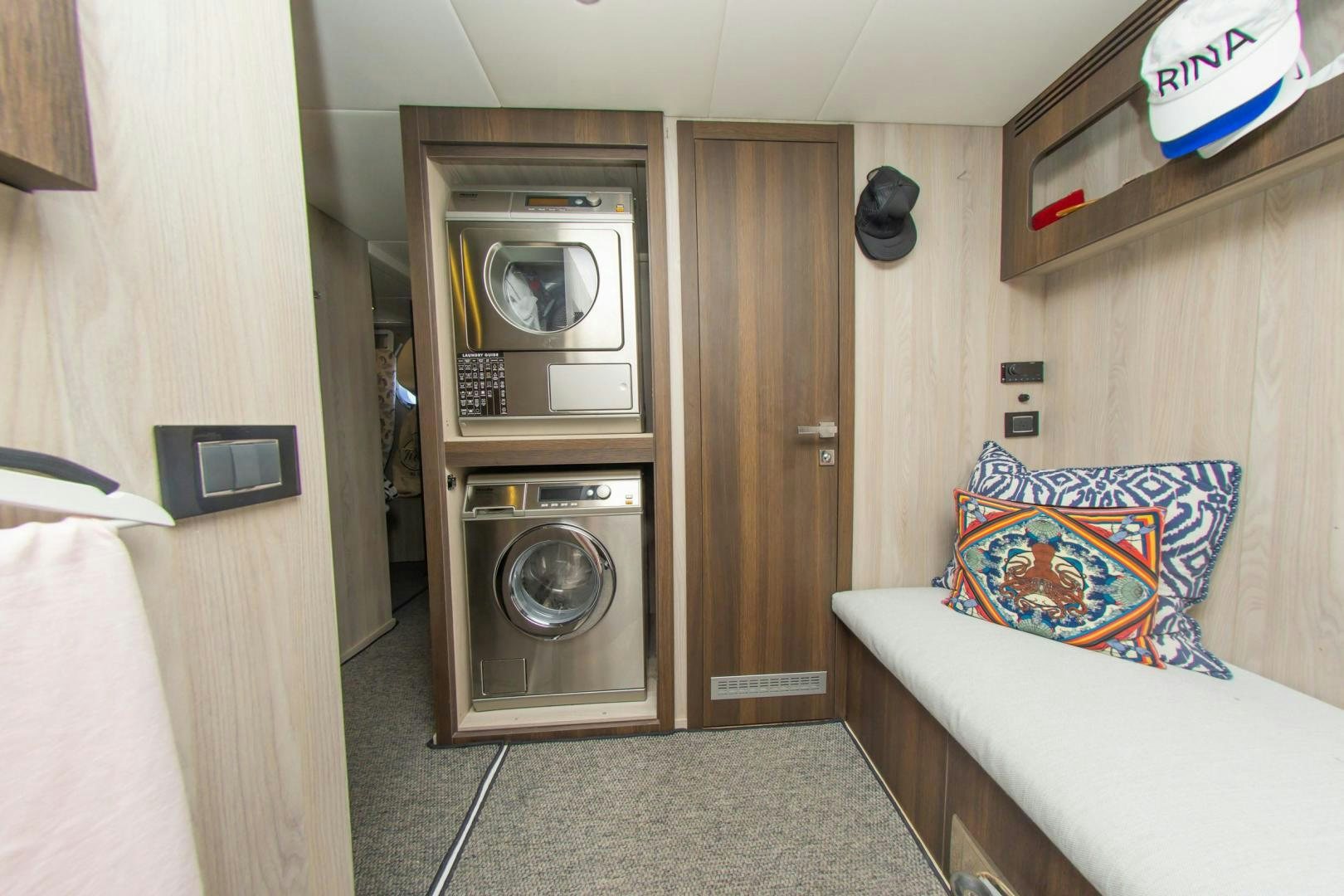 a room with a bed and a microwave aboard RINA Yacht for Sale