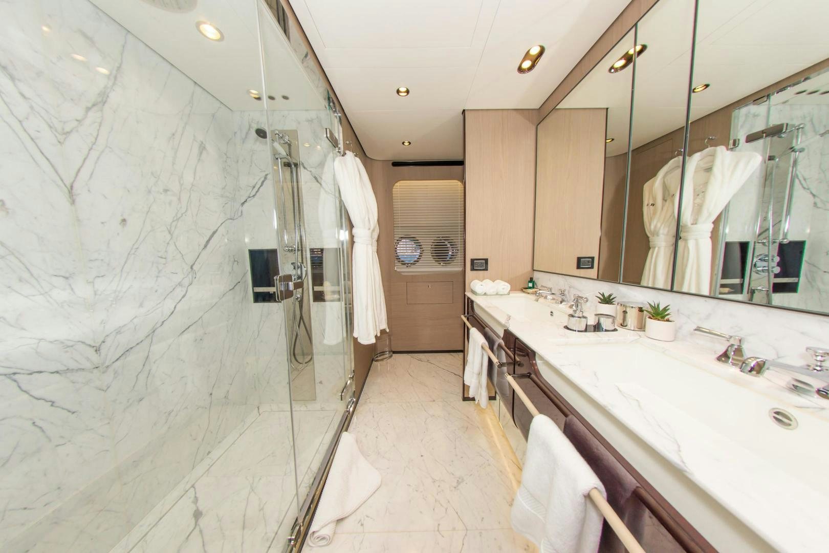 a bathroom with a large mirror aboard RINA Yacht for Sale