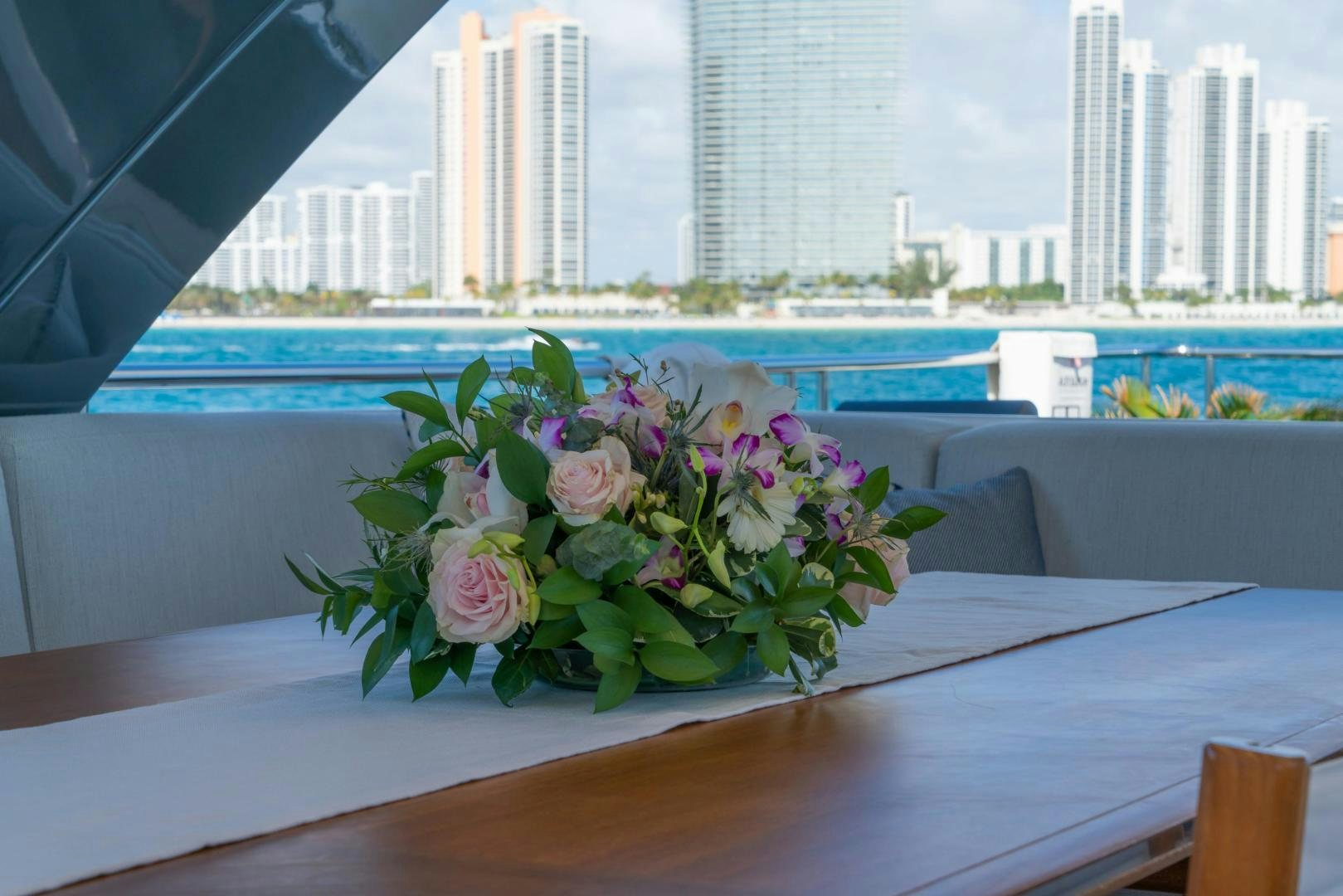 a bouquet of flowers on a table aboard RINA Yacht for Sale