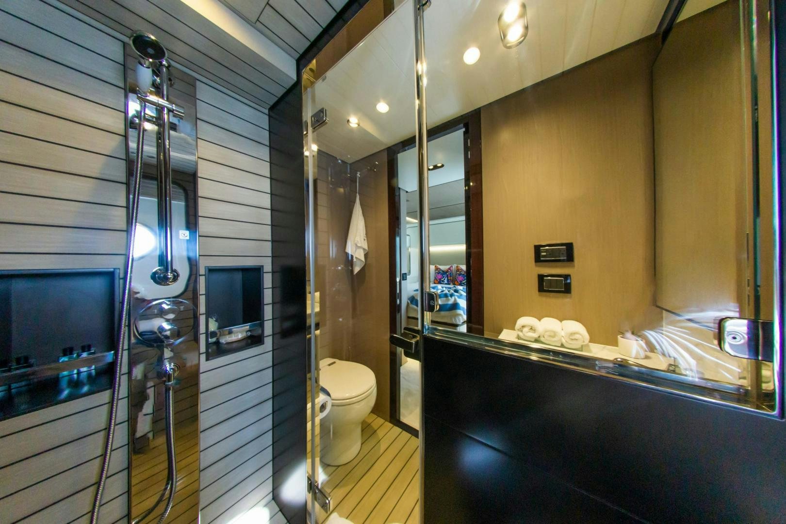 a bathroom with a glass shower aboard RINA Yacht for Sale