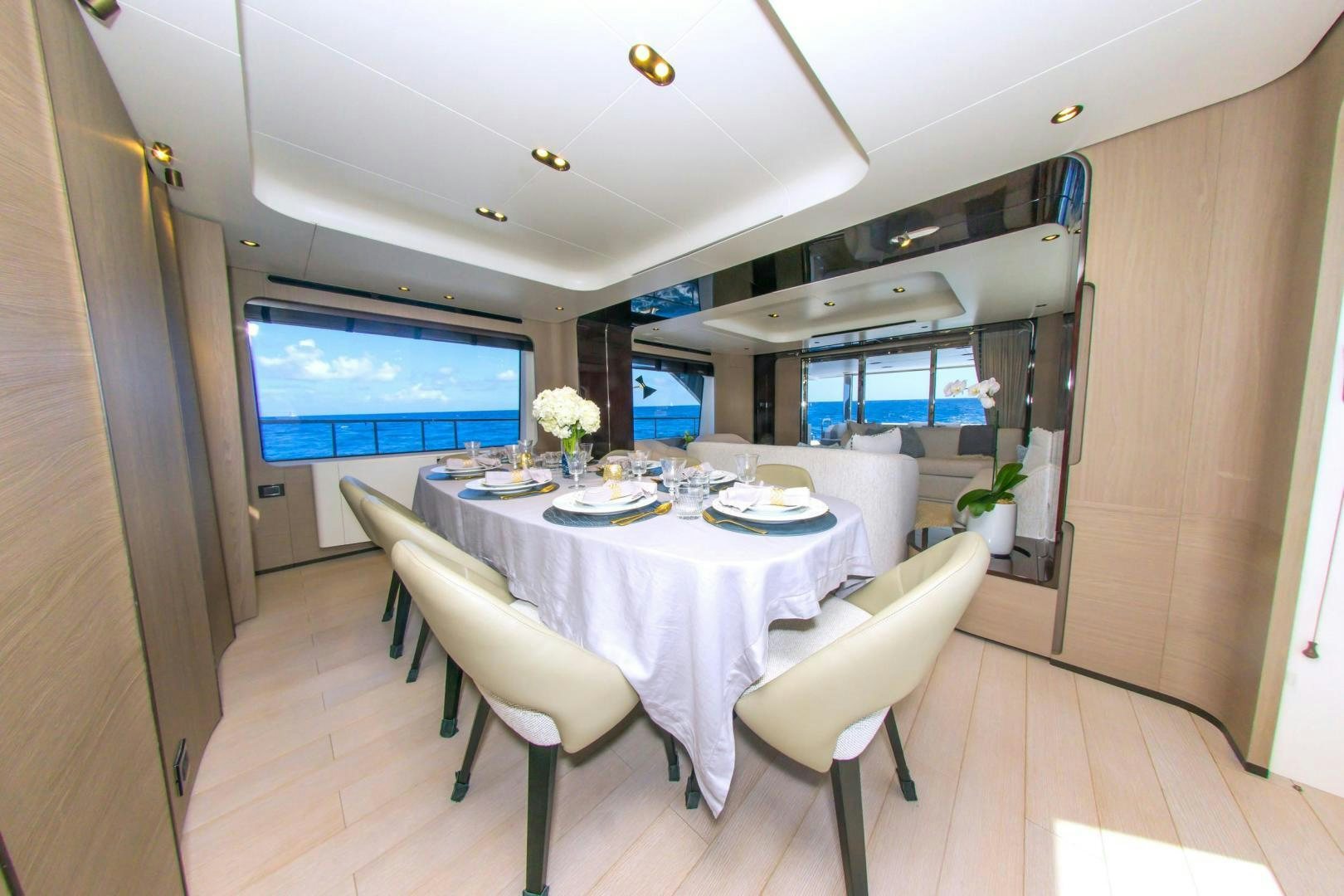 a dining table and chairs aboard RINA Yacht for Sale