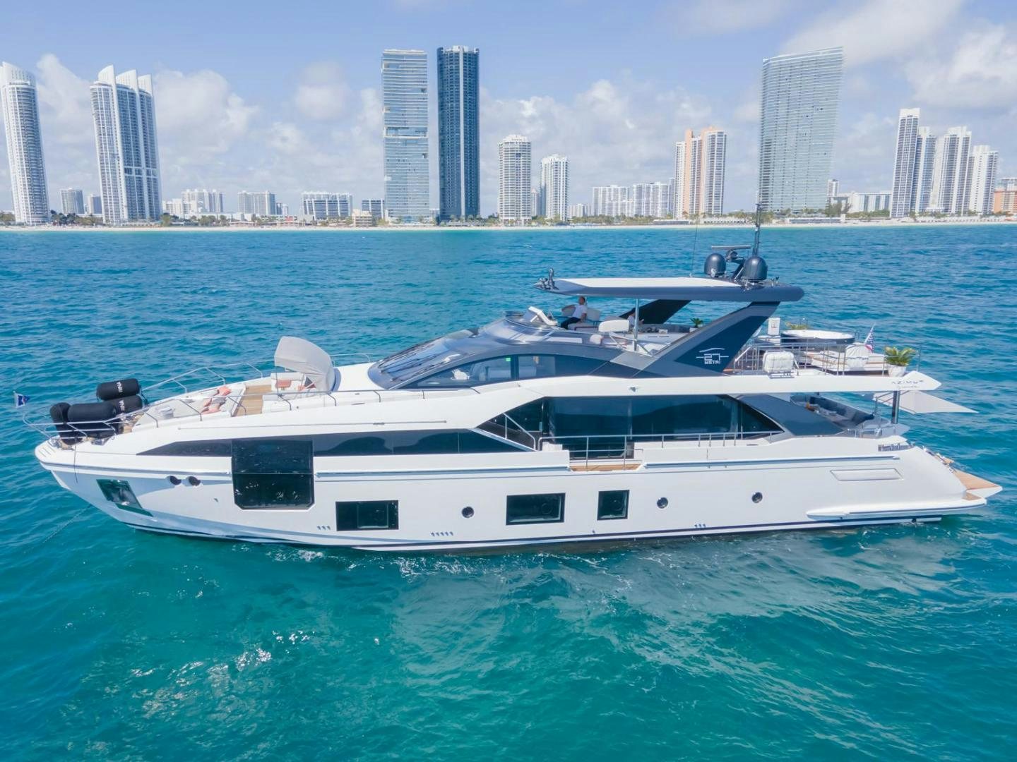 a white yacht in the water aboard RINA Yacht for Sale