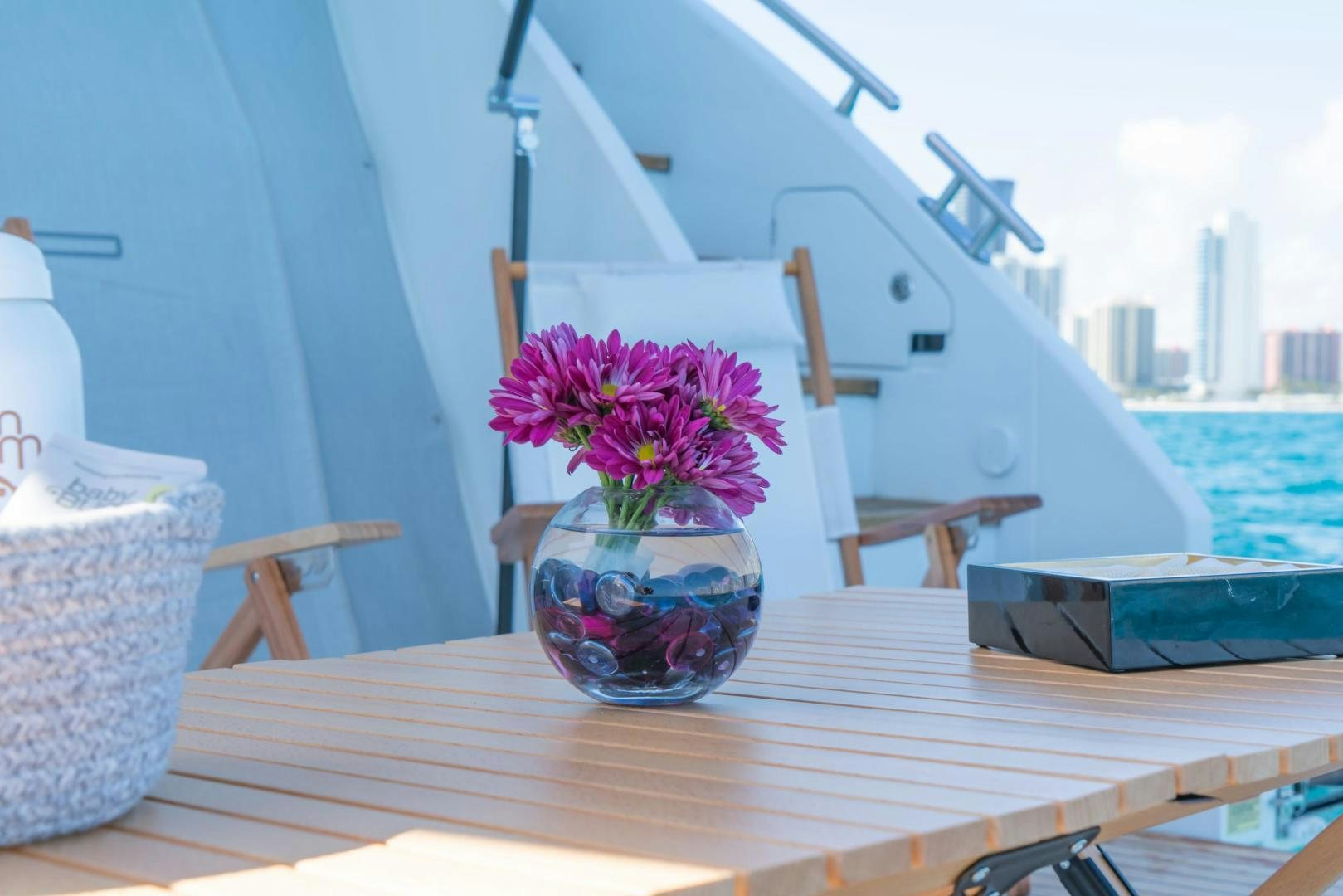 a vase with flowers on a table aboard RINA Yacht for Sale