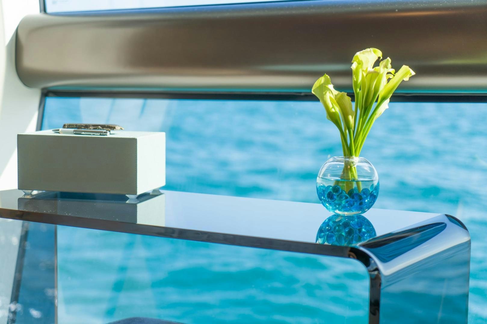 a plant in a glass vase aboard RINA Yacht for Sale