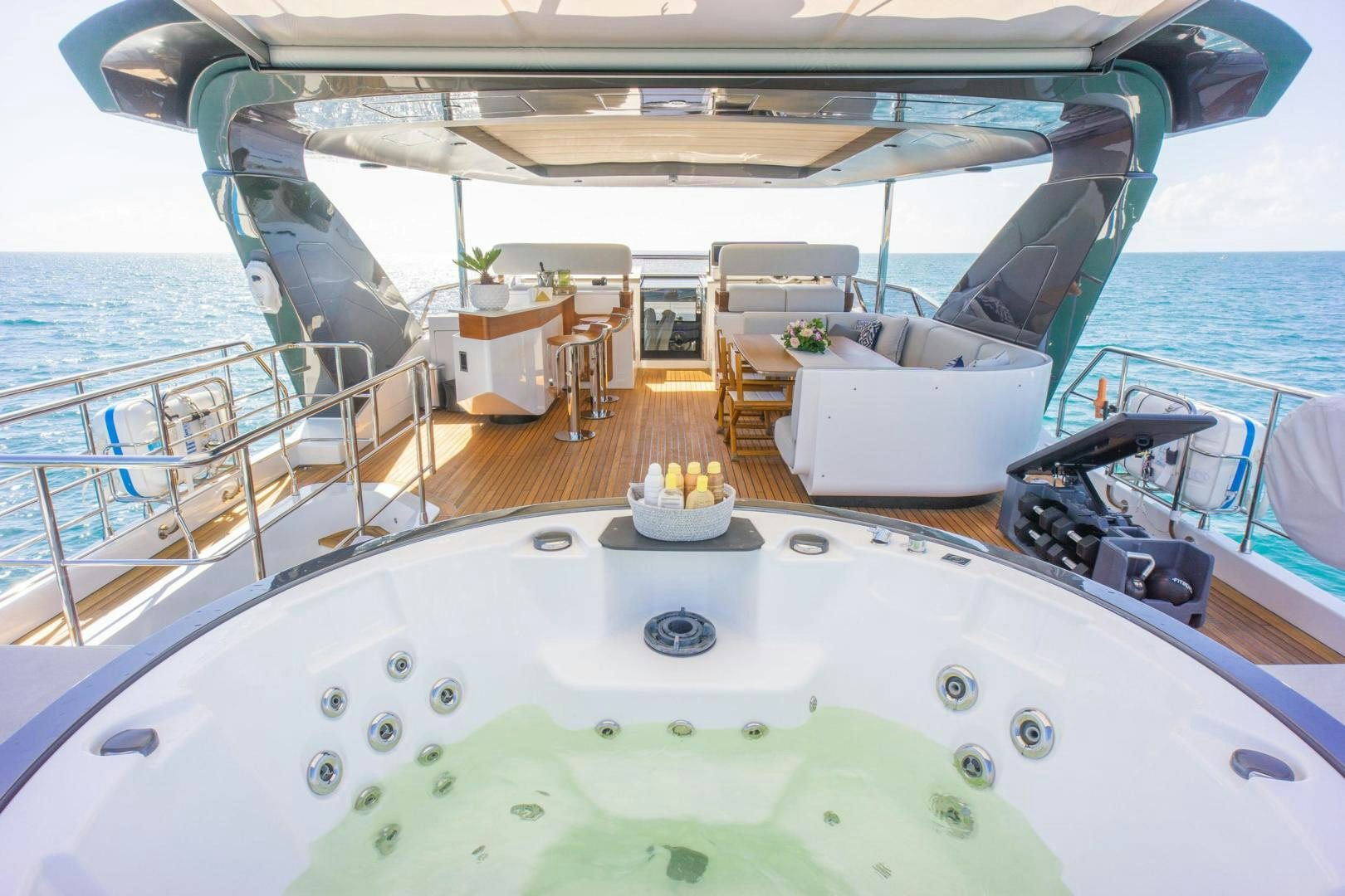 a boat with a table and chairs on the deck aboard RINA Yacht for Sale