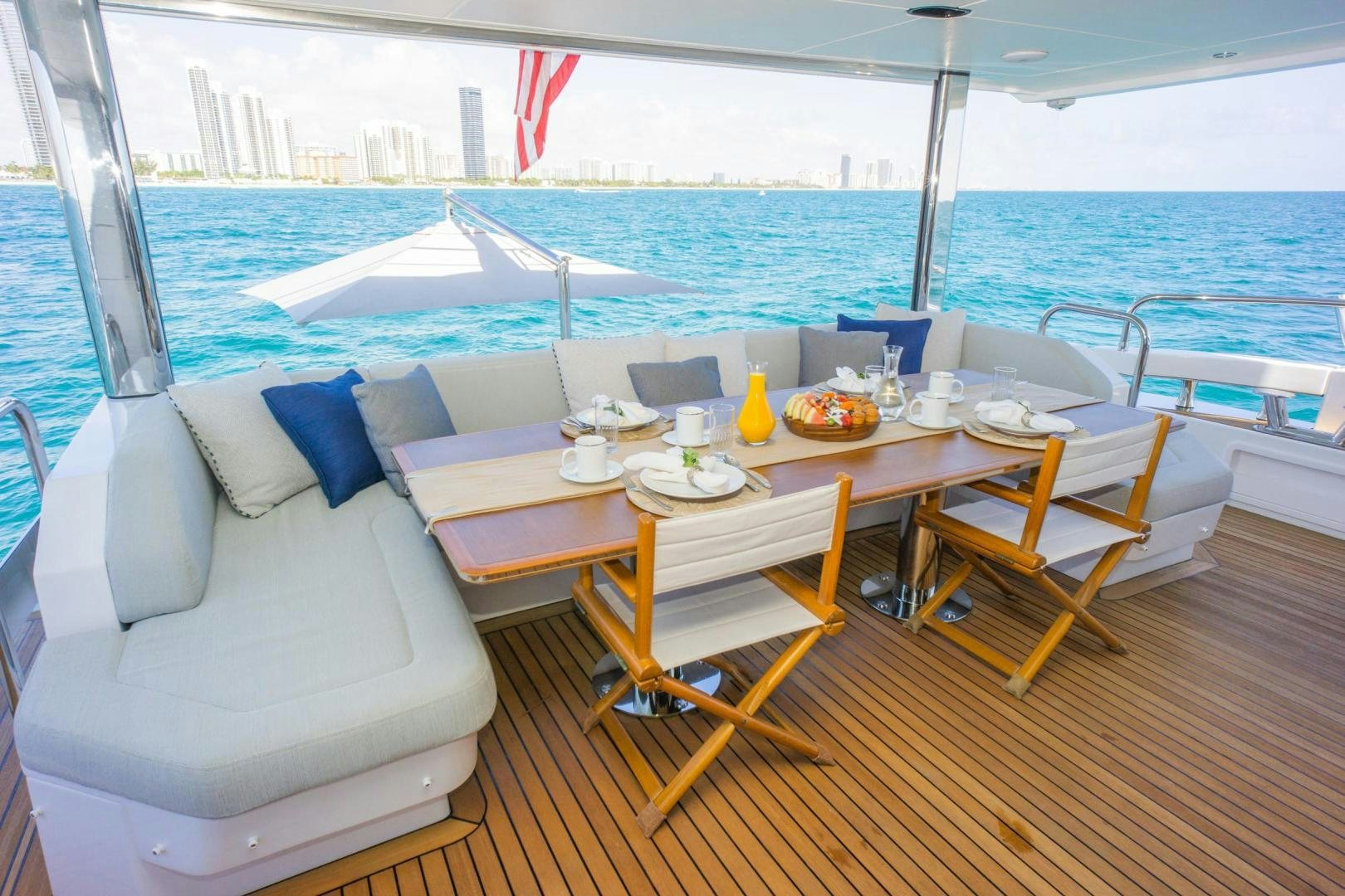 a table with chairs on it aboard RINA Yacht for Sale