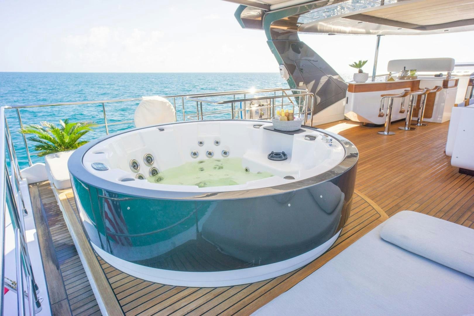 a pool with a large round tub aboard RINA Yacht for Sale