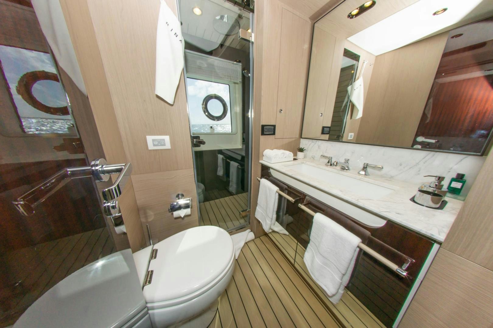 a bathroom with a large mirror aboard RINA Yacht for Sale