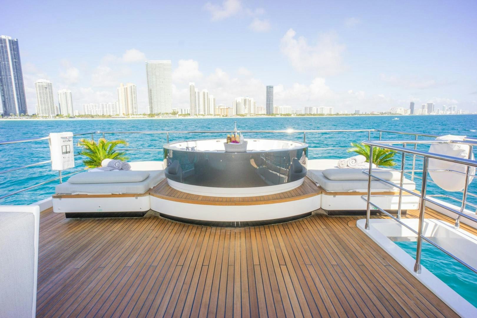 a deck with a view of a city and water aboard RINA Yacht for Sale