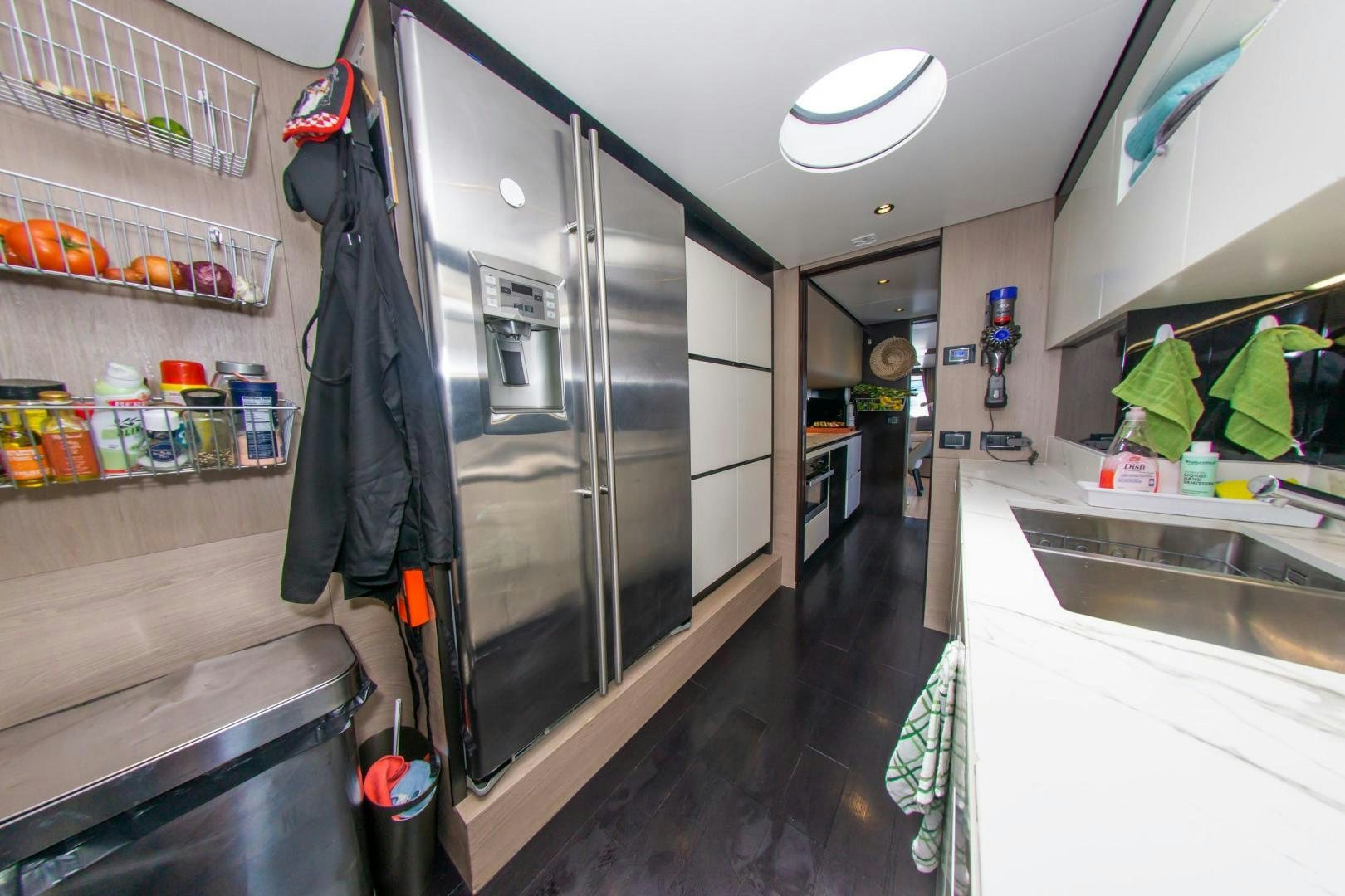 a large kitchen with a large glass shower unit aboard RINA Yacht for Sale