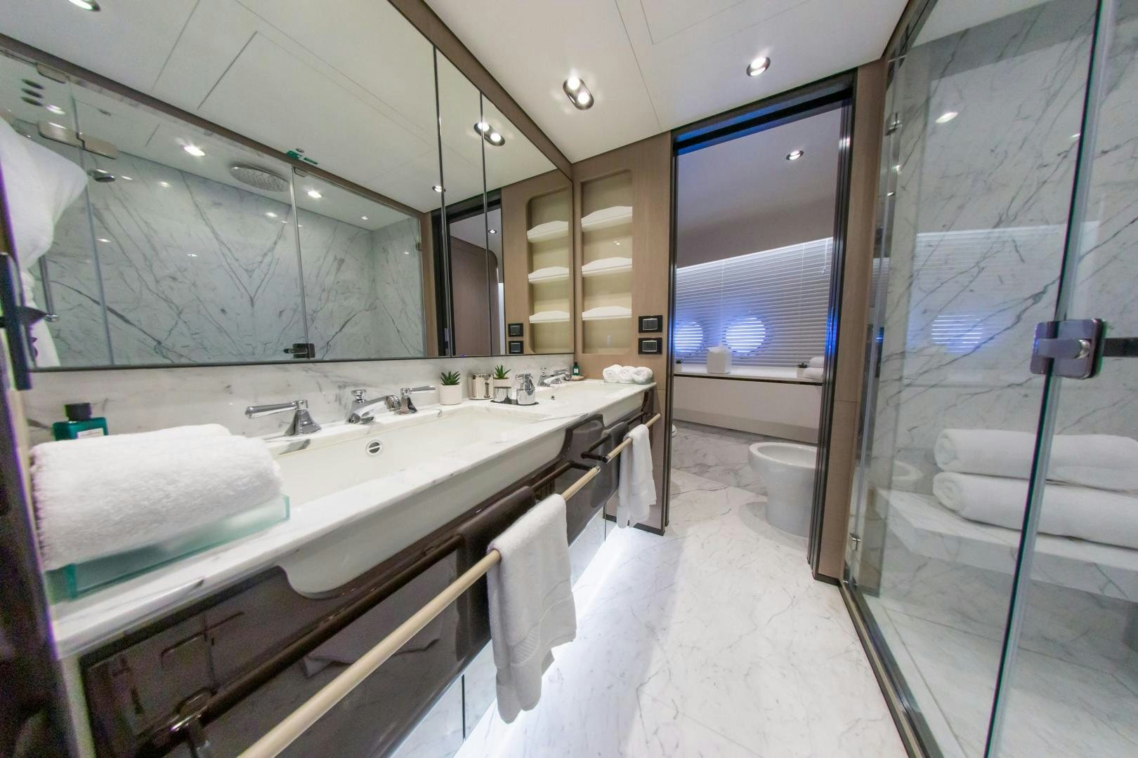 a bathroom with a large mirror aboard RINA Yacht for Sale
