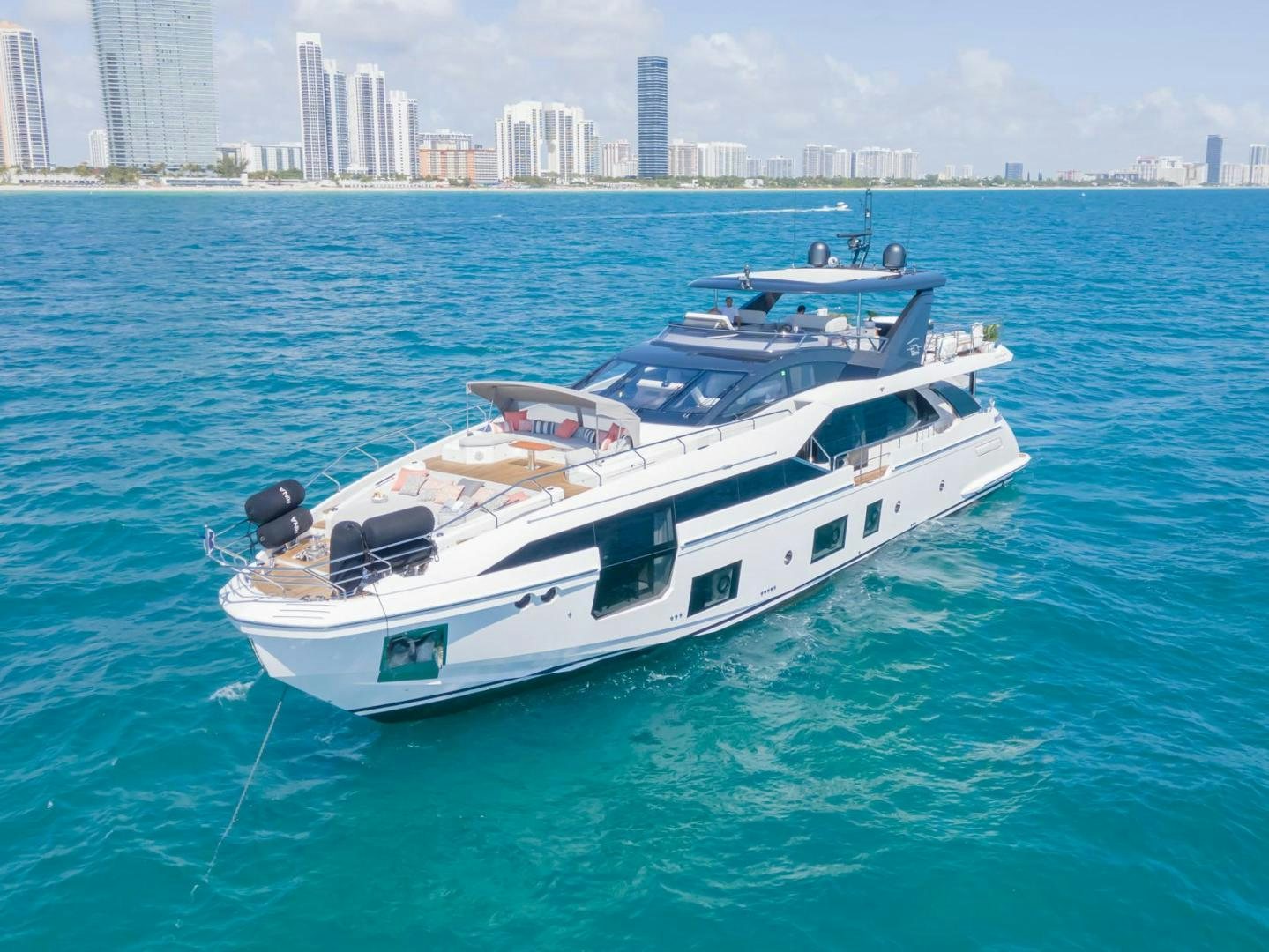 a white yacht in the water aboard RINA Yacht for Sale
