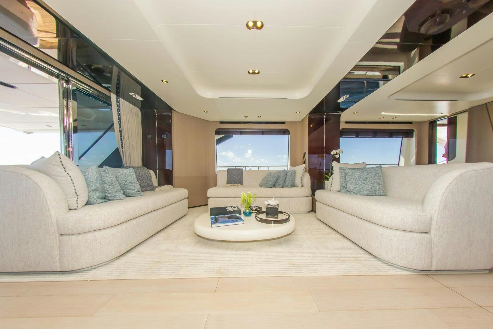 a living room with a couch and a table aboard RINA Yacht for Sale