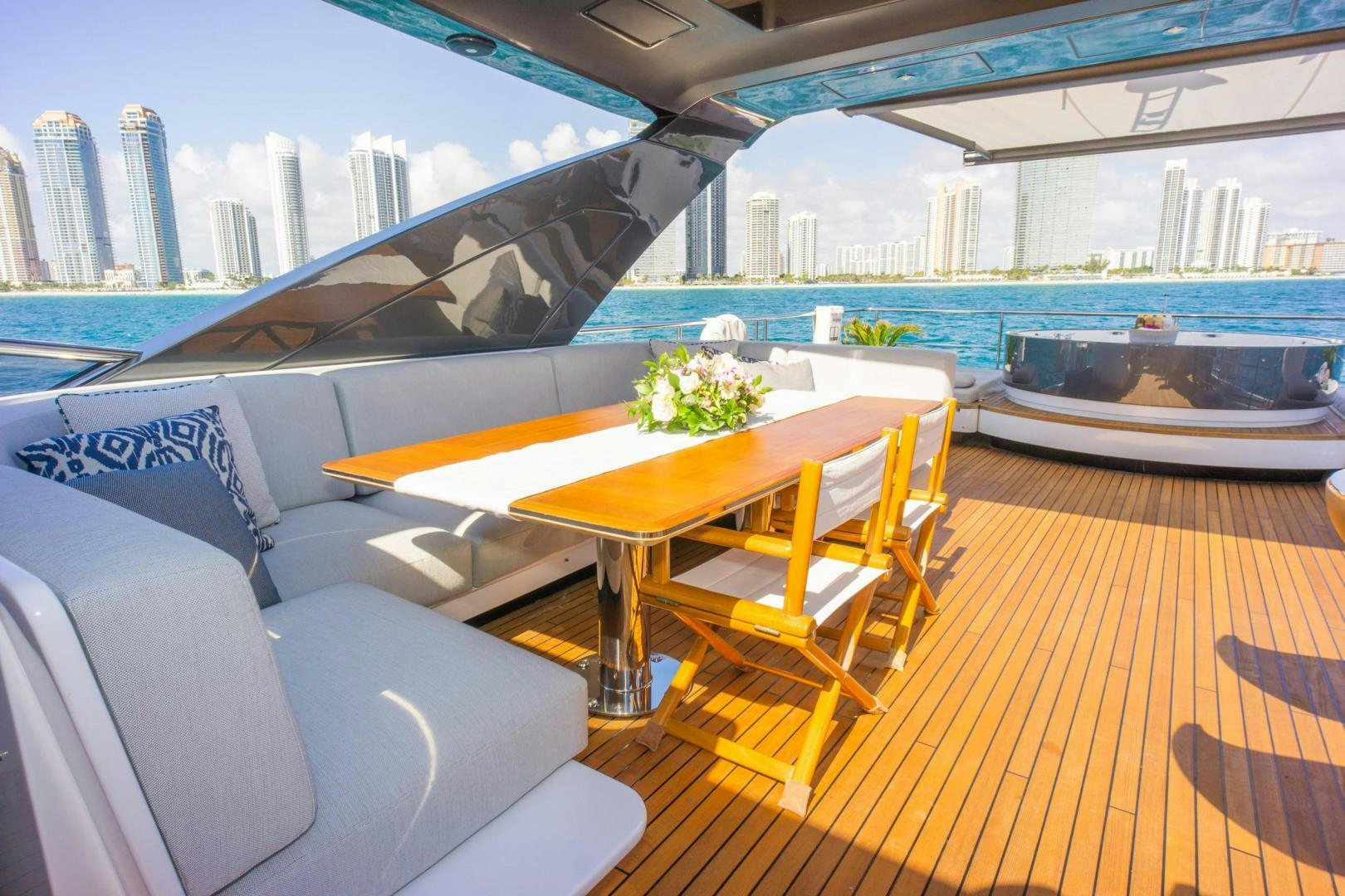 a room with a table and chairs aboard RINA Yacht for Sale