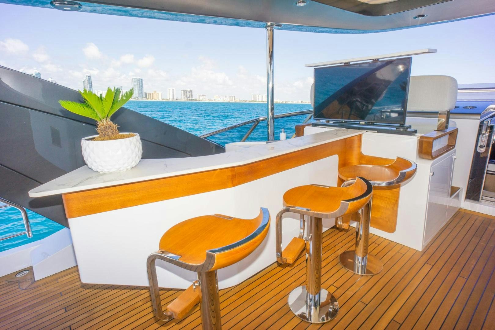 a room with a table and chairs aboard RINA Yacht for Sale