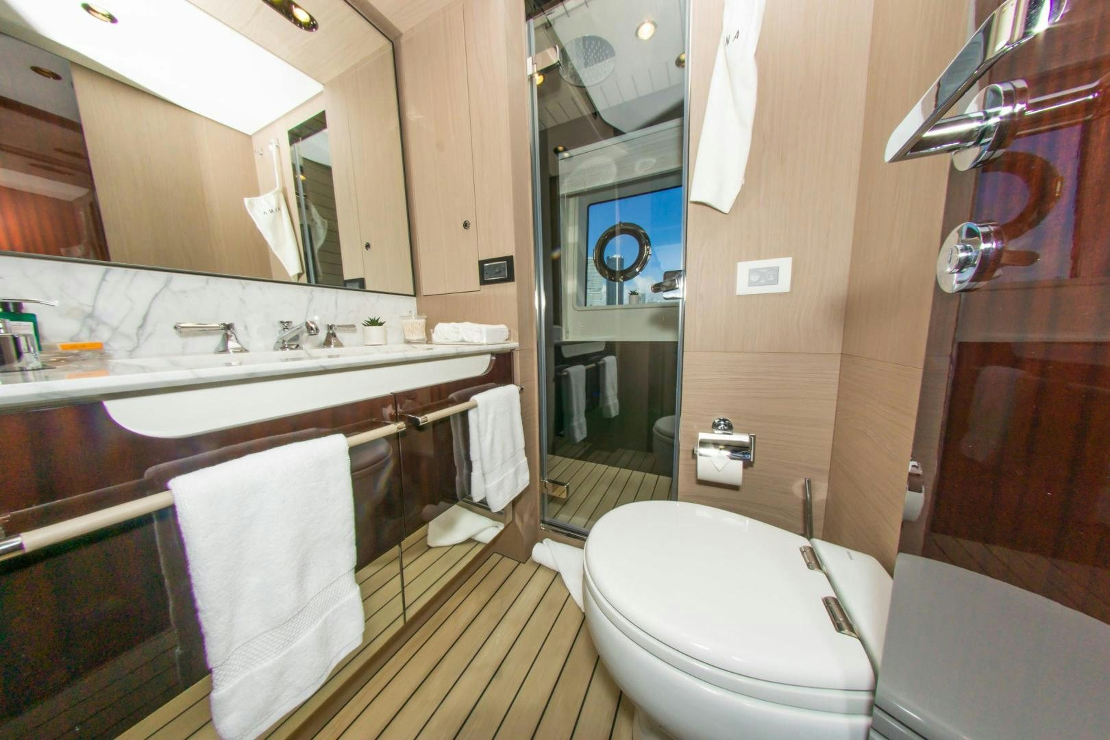 a bathroom with a sink toilet and bathtub aboard RINA Yacht for Sale