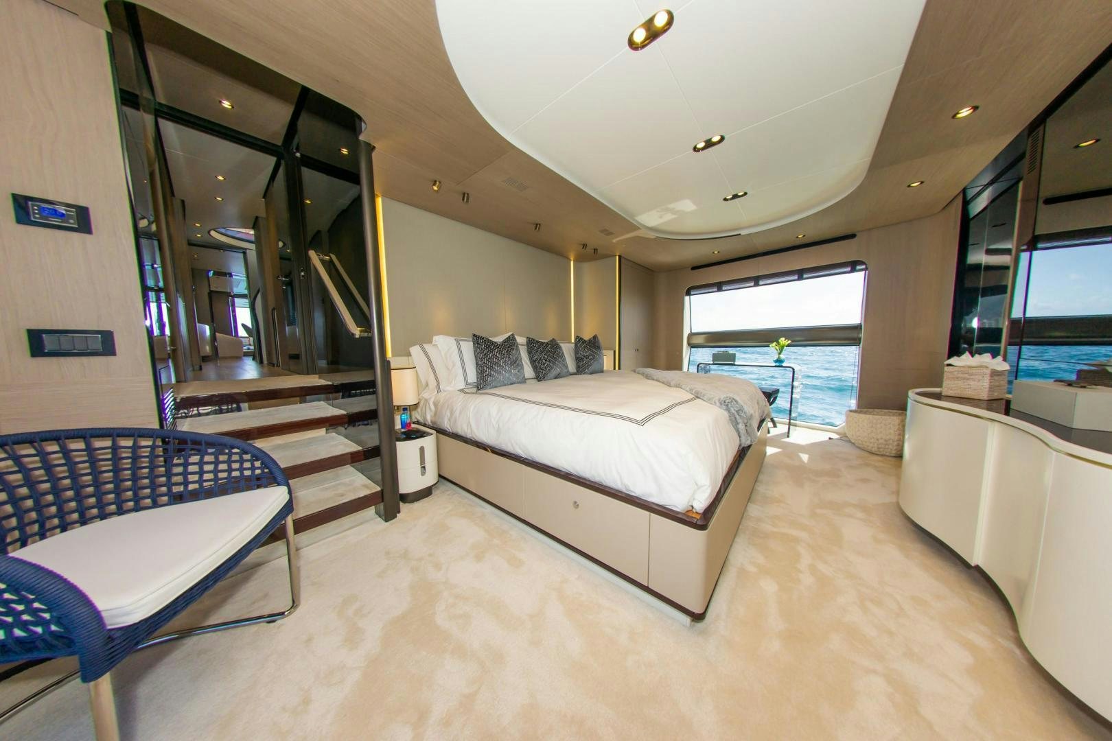 a bedroom with a bed and a balcony aboard RINA Yacht for Sale