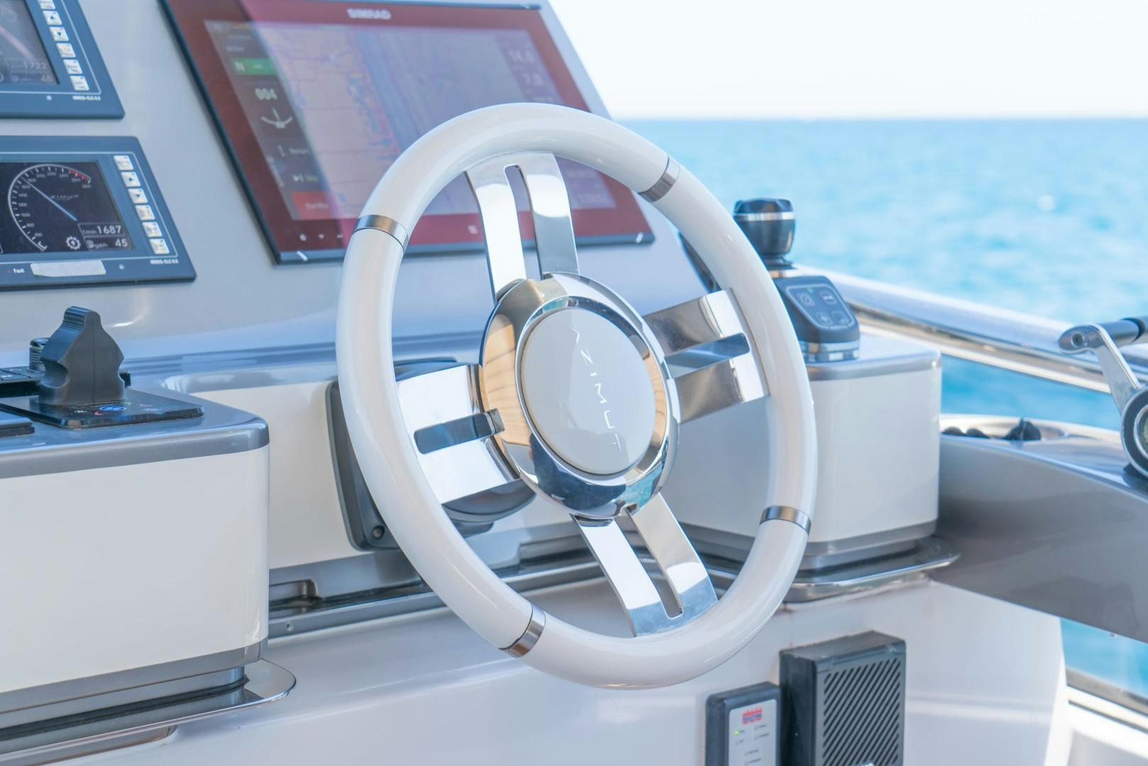 a steering wheel on a boat aboard RINA Yacht for Sale
