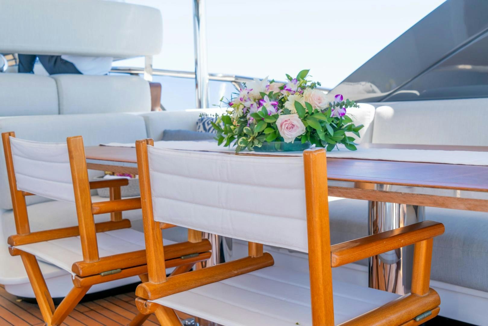 a flower bouquet on a bench aboard RINA Yacht for Sale