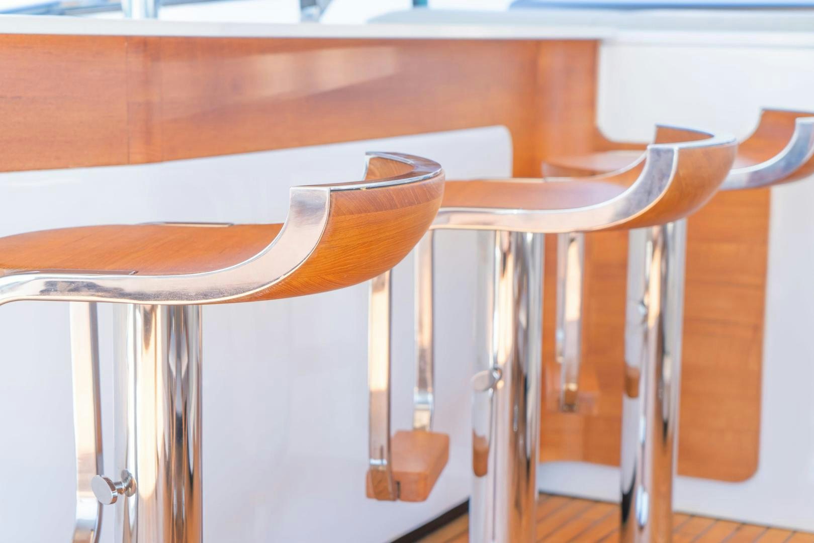 a wooden table with a wooden chair aboard RINA Yacht for Sale