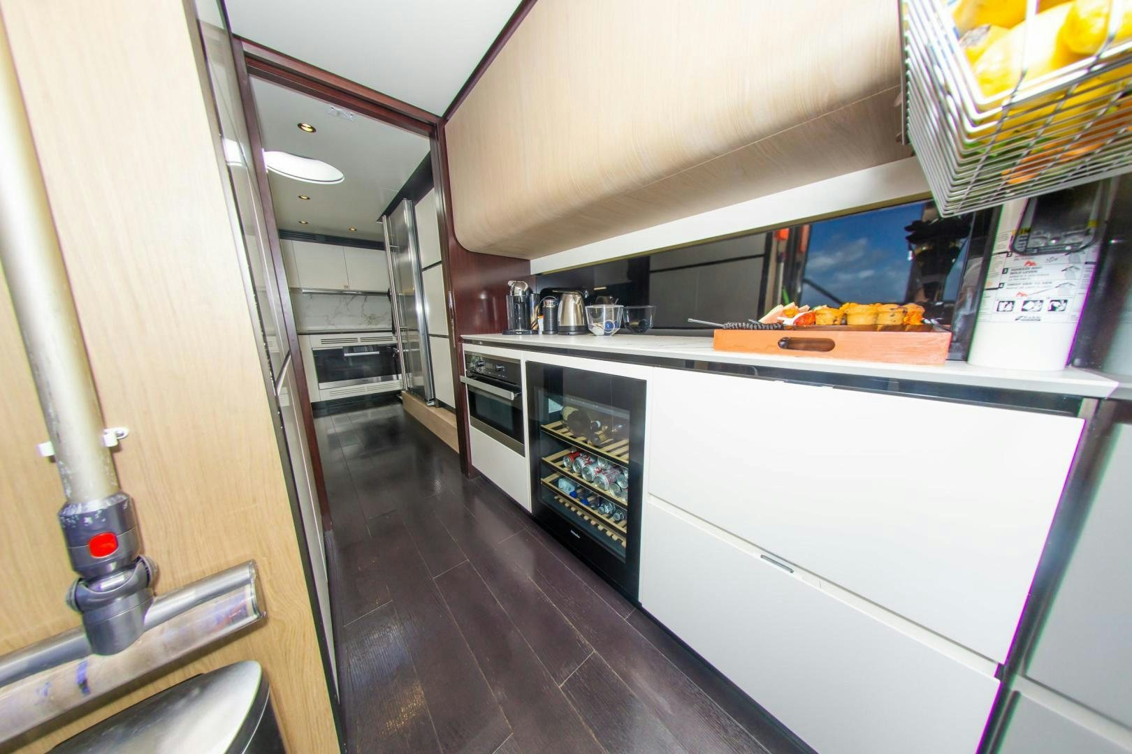 a kitchen with a large refrigerator aboard RINA Yacht for Sale