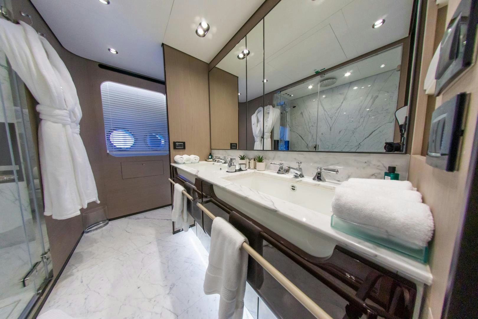 a bathroom with a large mirror aboard RINA Yacht for Sale