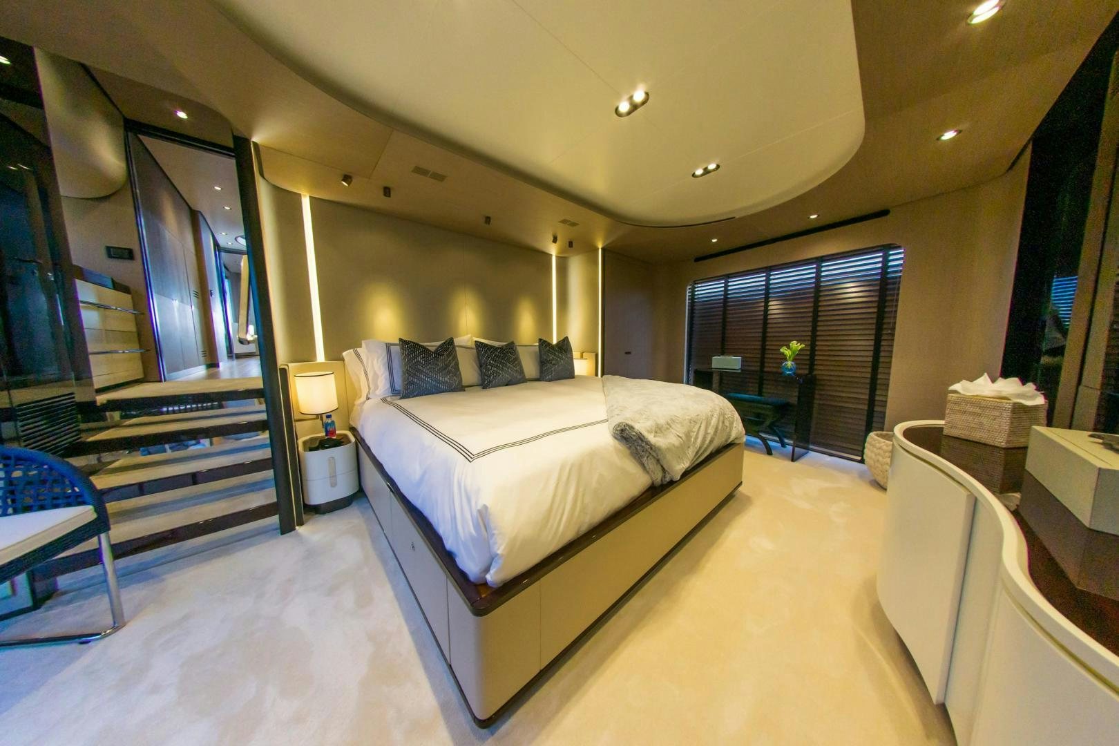 a large bedroom with a large bed aboard RINA Yacht for Sale