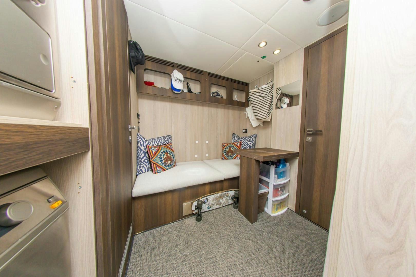 a small bedroom with a bed aboard RINA Yacht for Sale