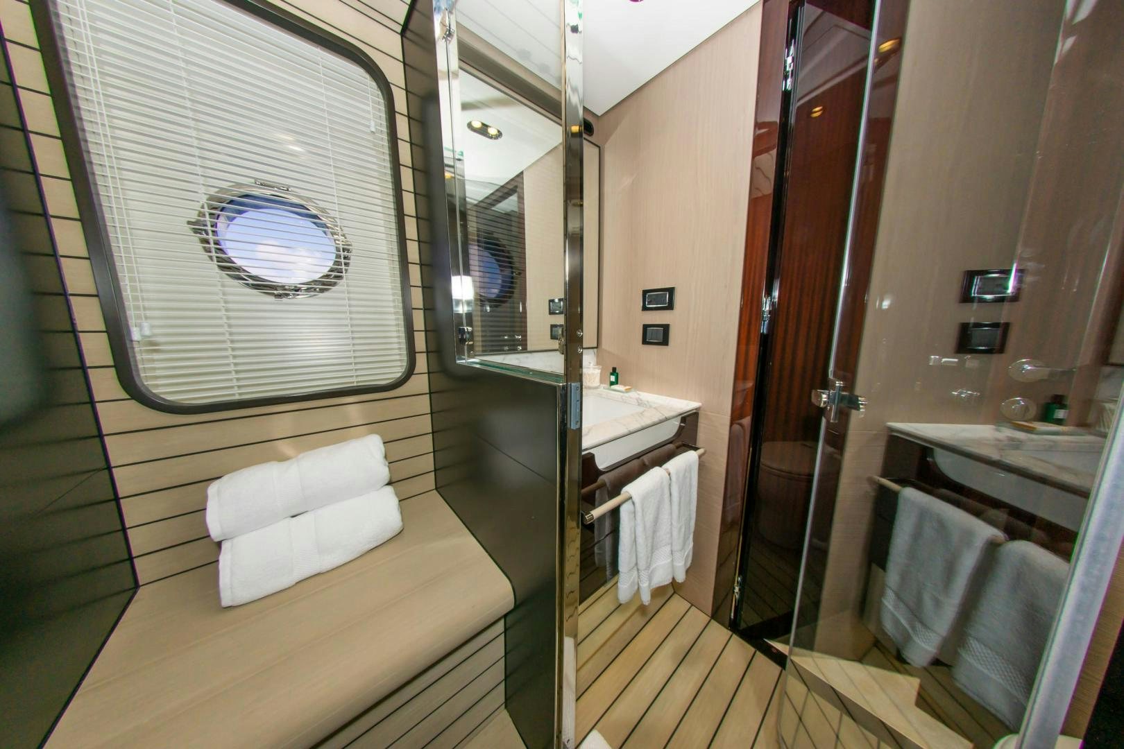 a bathroom with a large mirror aboard RINA Yacht for Sale