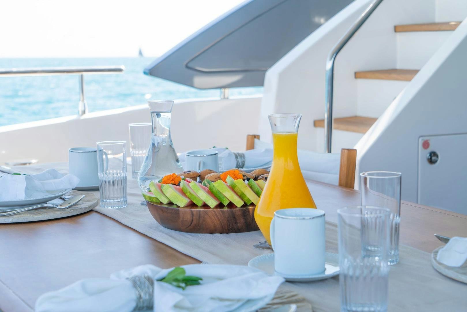 a basket of fruits on a table aboard RINA Yacht for Sale