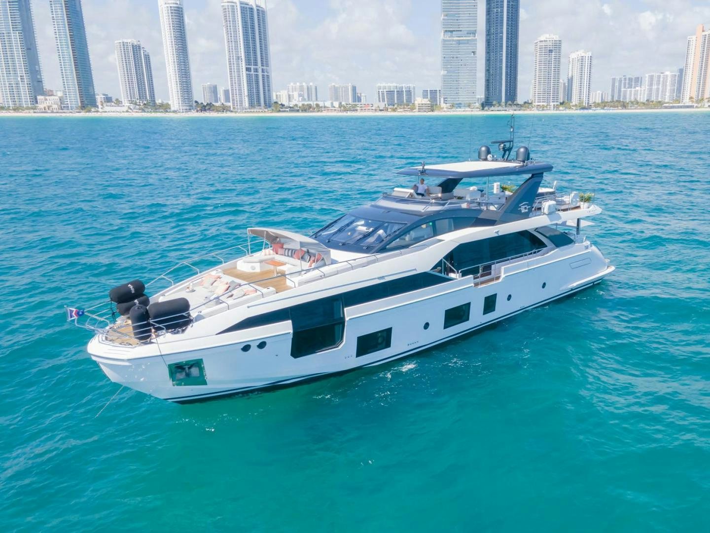 a white yacht in the water aboard RINA Yacht for Sale