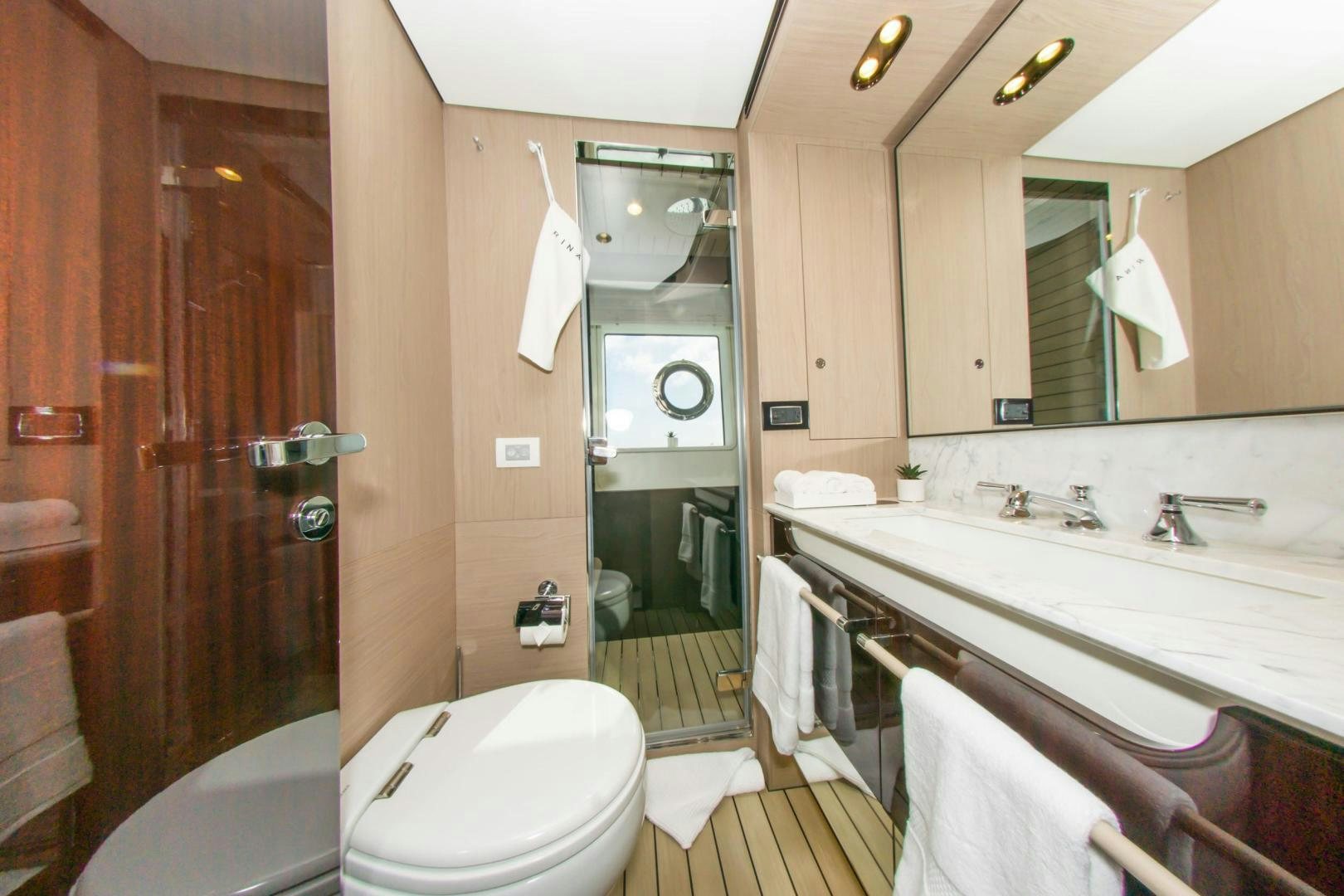 a bathroom with a sink toilet and bathtub aboard RINA Yacht for Sale