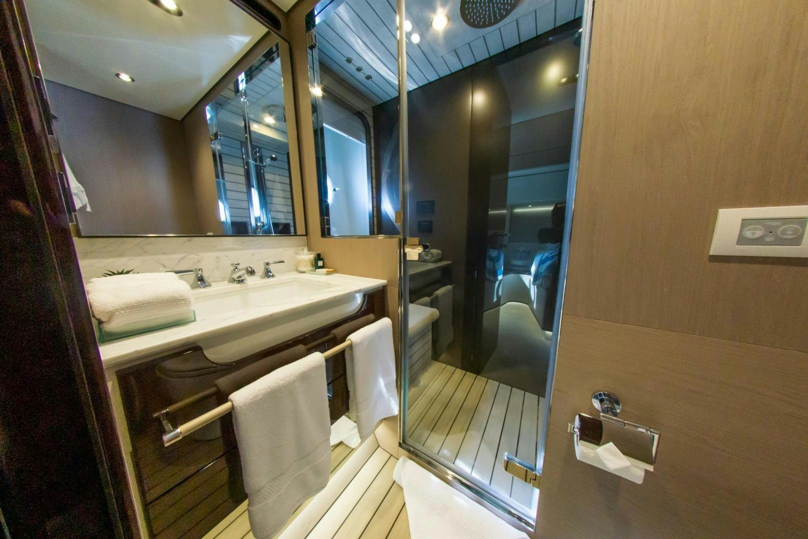 a bathroom with a large mirror aboard RINA Yacht for Sale