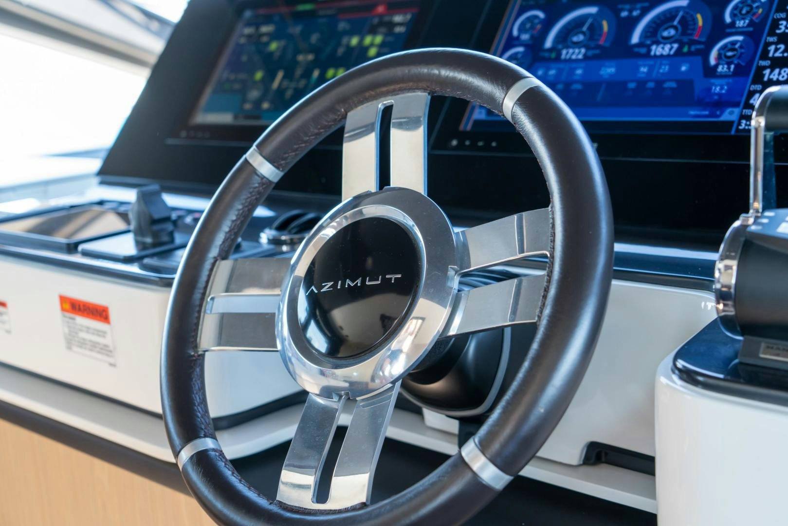 a steering wheel in a car aboard RINA Yacht for Sale