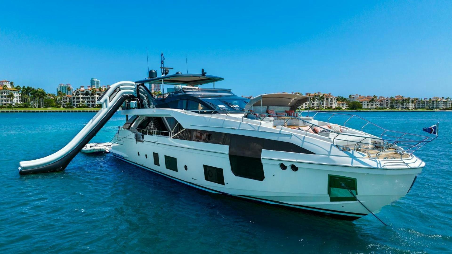 a white yacht on the water aboard RINA Yacht for Sale