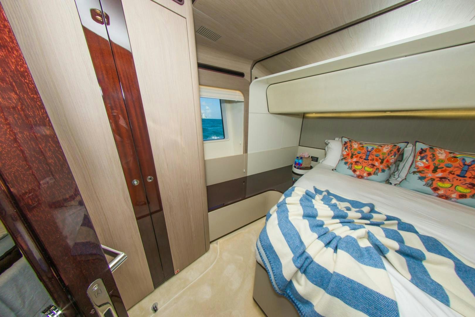 a bedroom with a double bed aboard RINA Yacht for Sale